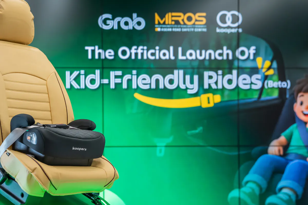 A child booster seat fitted in the rear passenger compartment of a vehicle