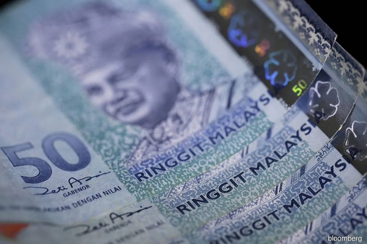 Illustration of Malaysian ringgit banknotes beside financial documents