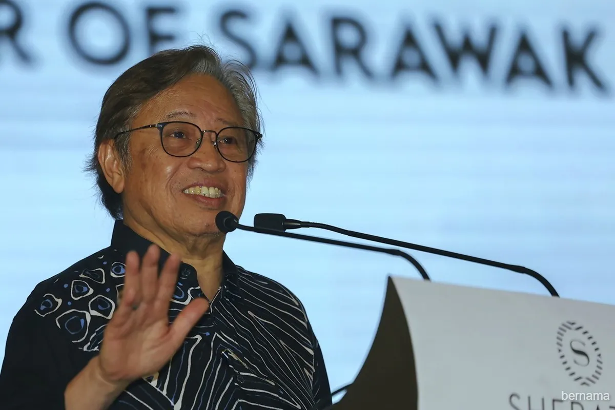 Neutral illustration of government funding documents and a map of Sarawak