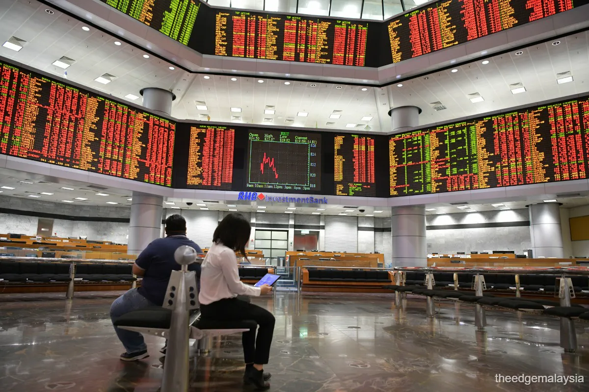 Electronic stock market board displaying share prices and index movements