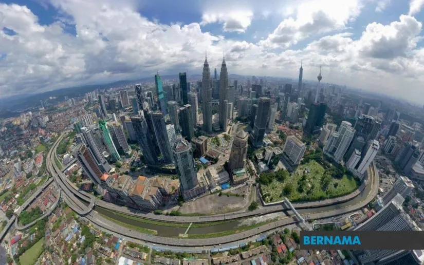 Commercial buildings and construction cranes in Kuala Lumpur