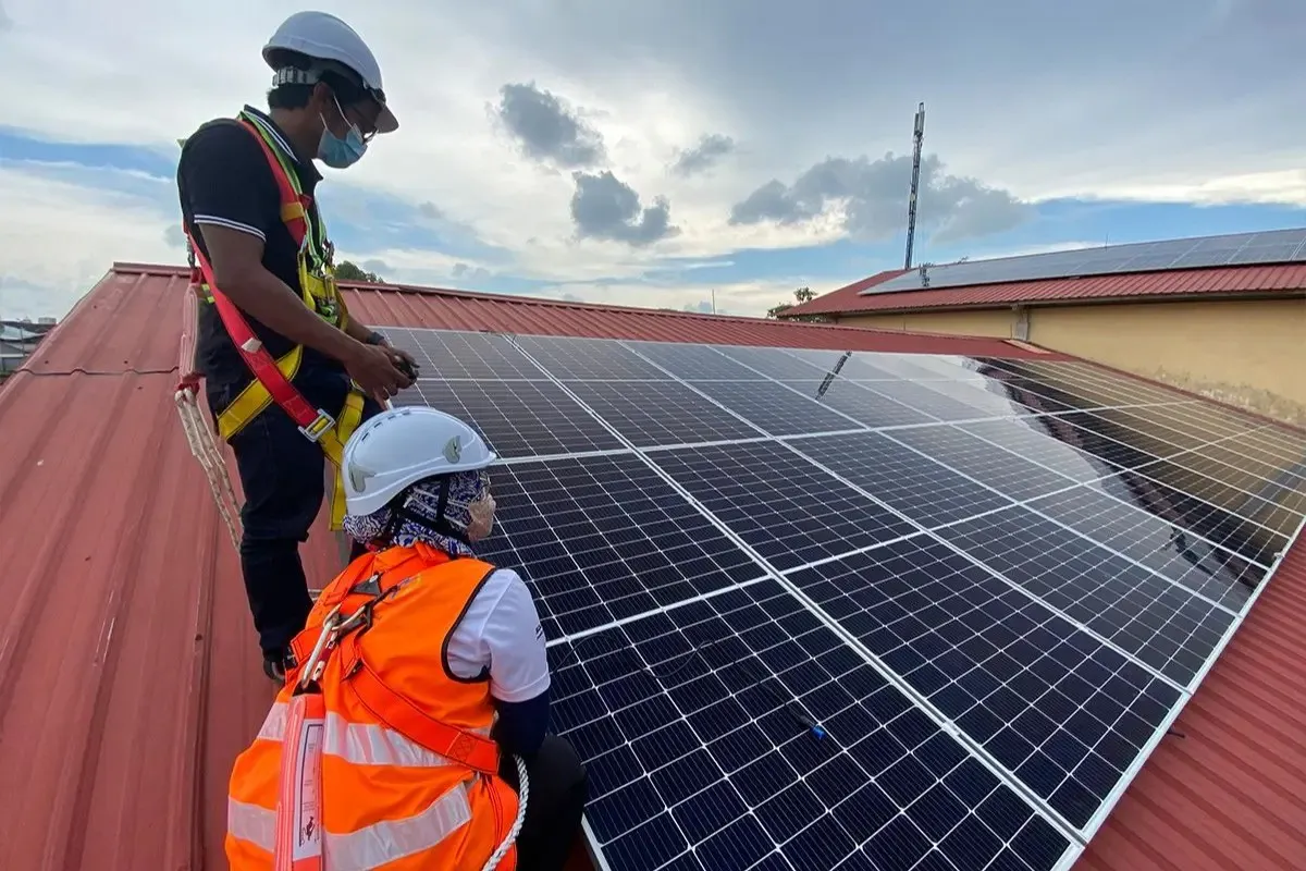 Solar panels alongside electricity transmission infrastructure