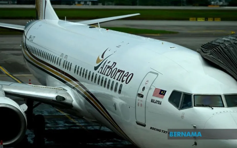 Passenger aircraft parked beside an airport terminal
