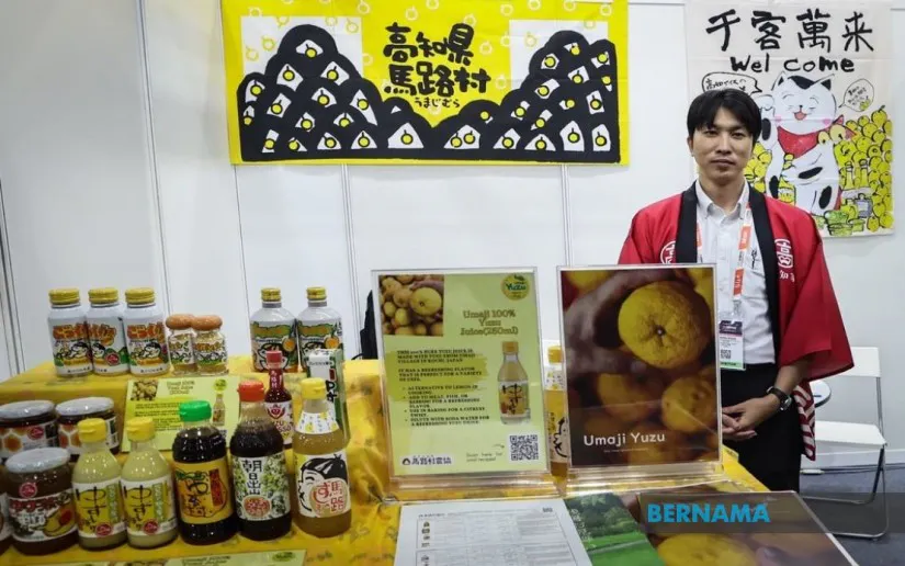 Yuzu fruit alongside citrus drinks and jars of jam
