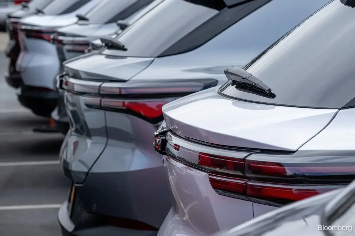 Passenger vehicles displayed in a car showroom