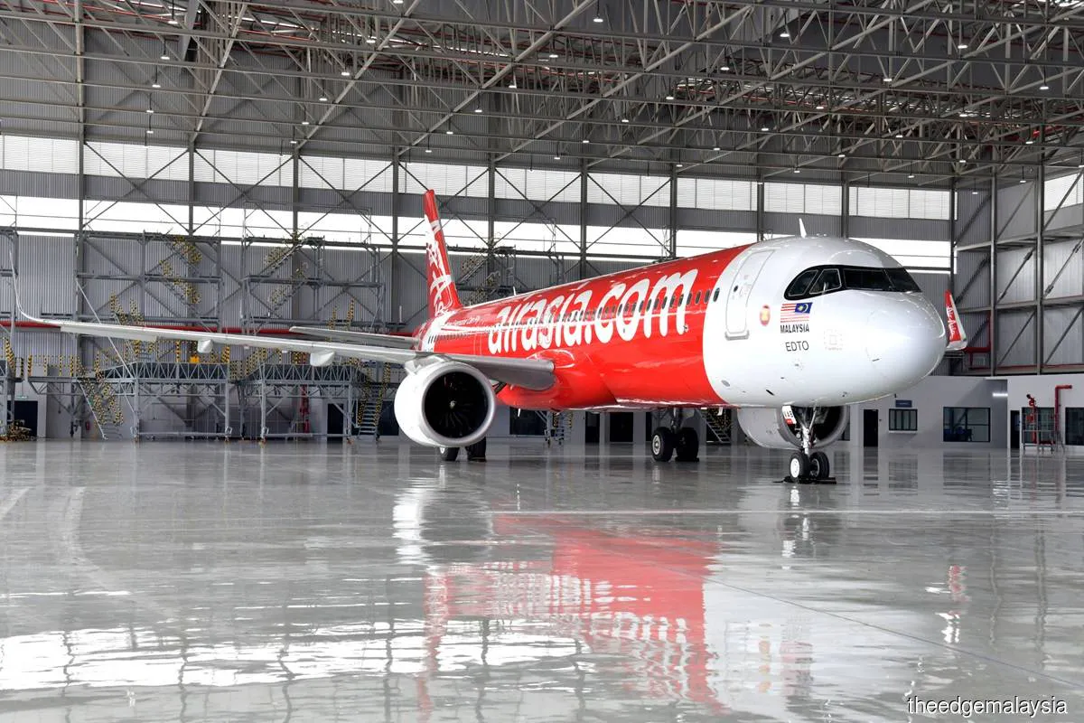 Passenger aircraft parked beside an airport terminal