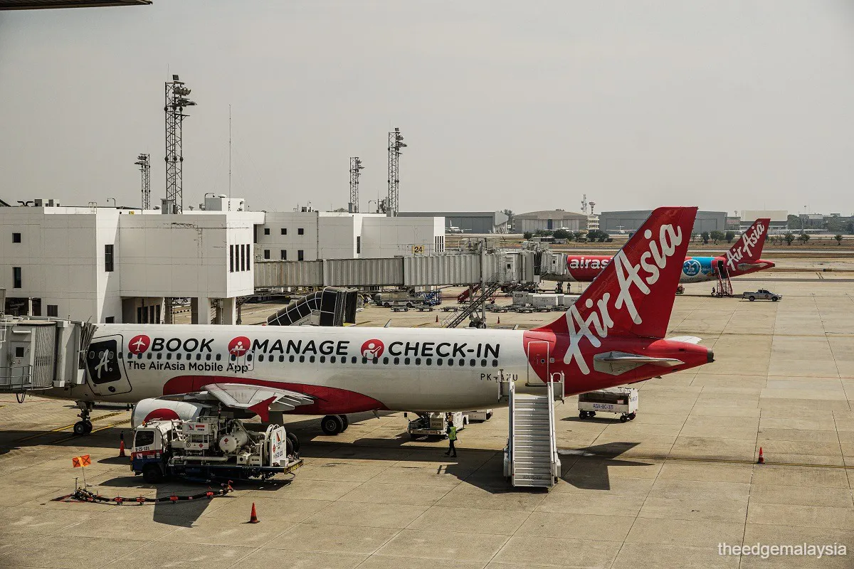 Passenger aircraft parked beside an airport terminal