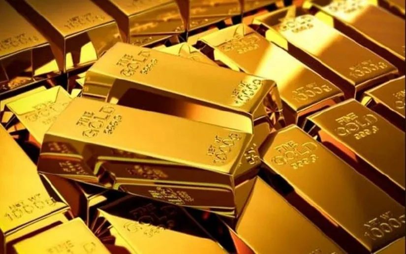 Gold bars arranged on a neutral background