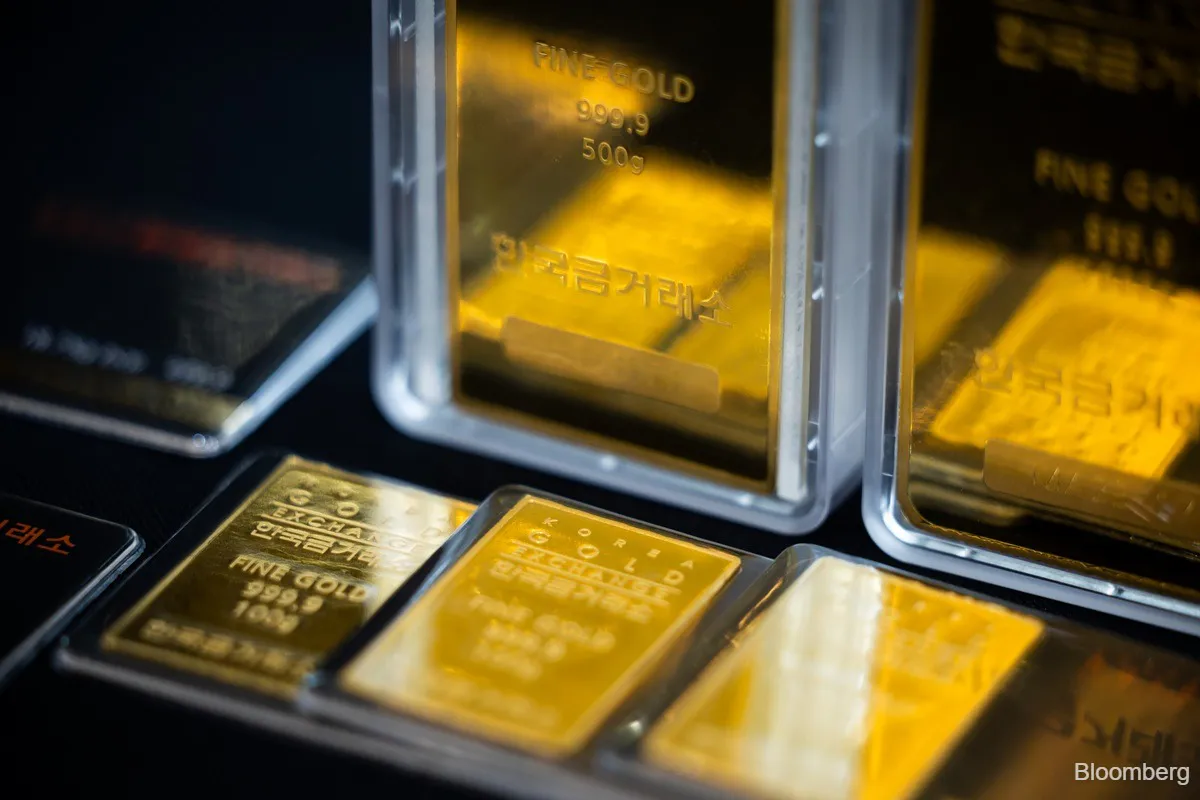 Gold bars arranged on a plain surface