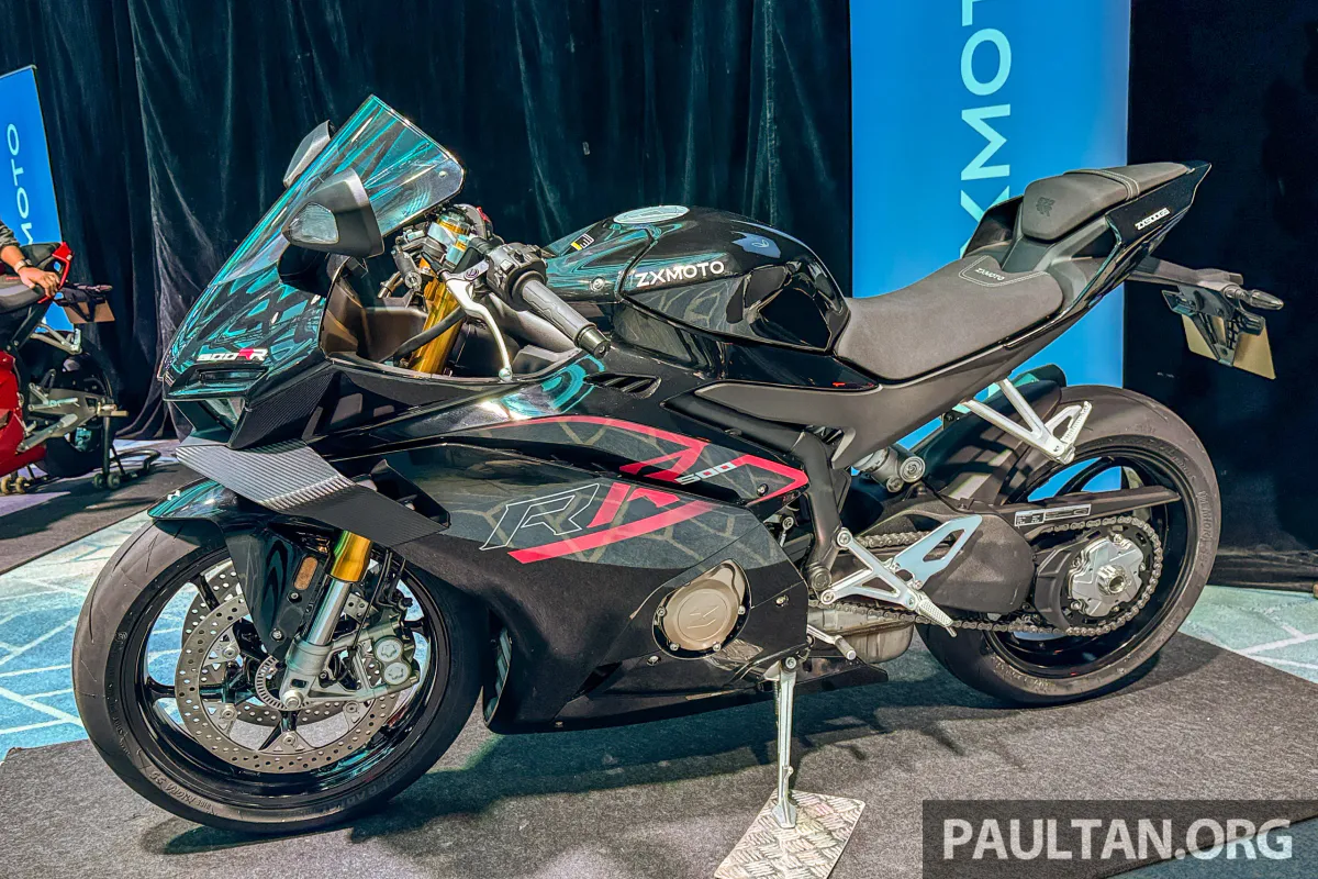Motorcycles displayed inside a dealership showroom
