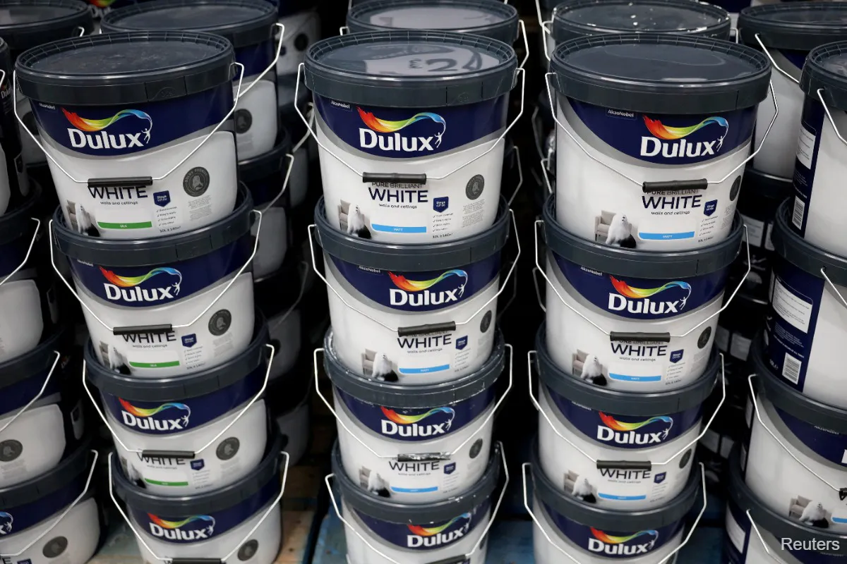 Paint tins and colour samples on a retail display