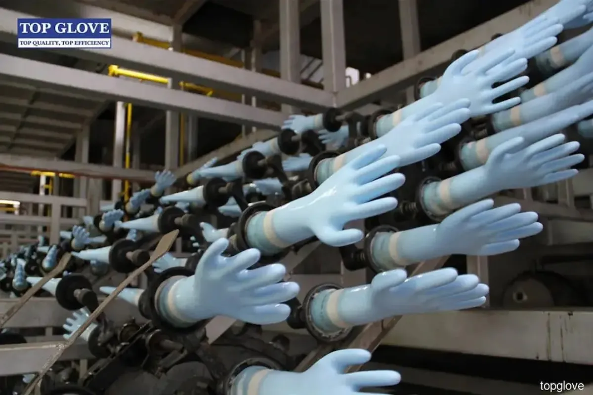 Disposable gloves beside industrial packaging