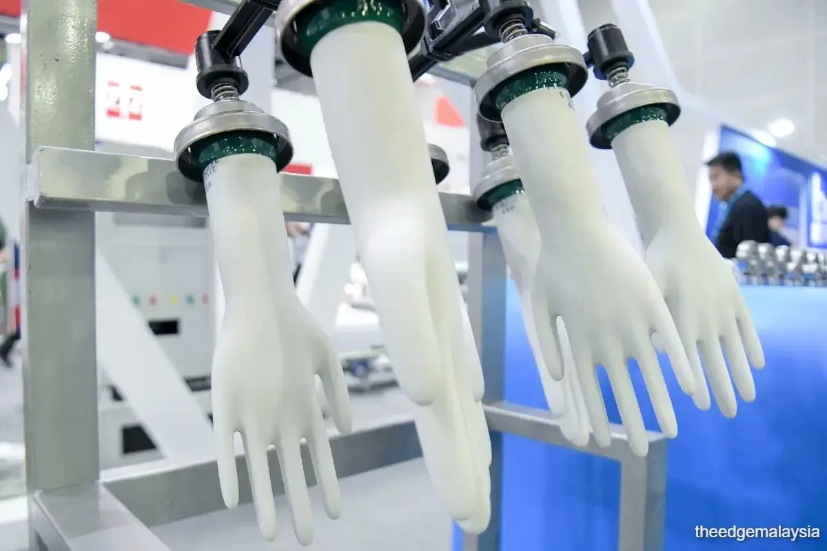 Protective gloves arranged on a production line