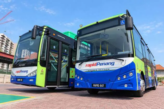 Illustration of an electric bus beside a charging station